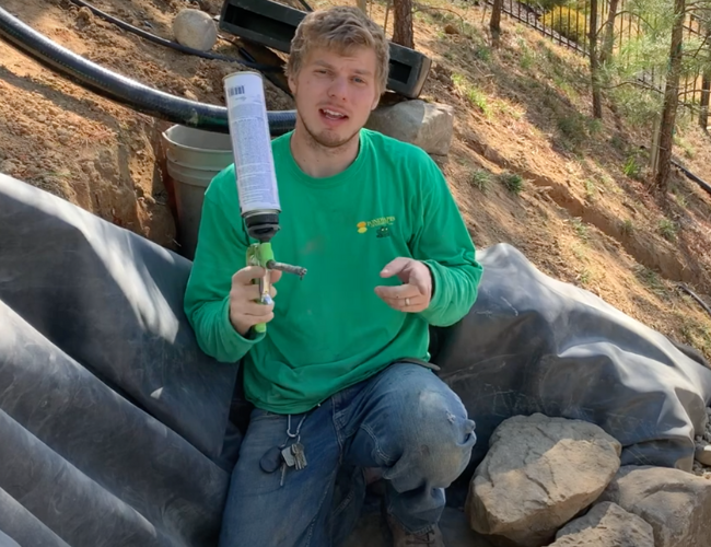 Man holding waterfall foam gun