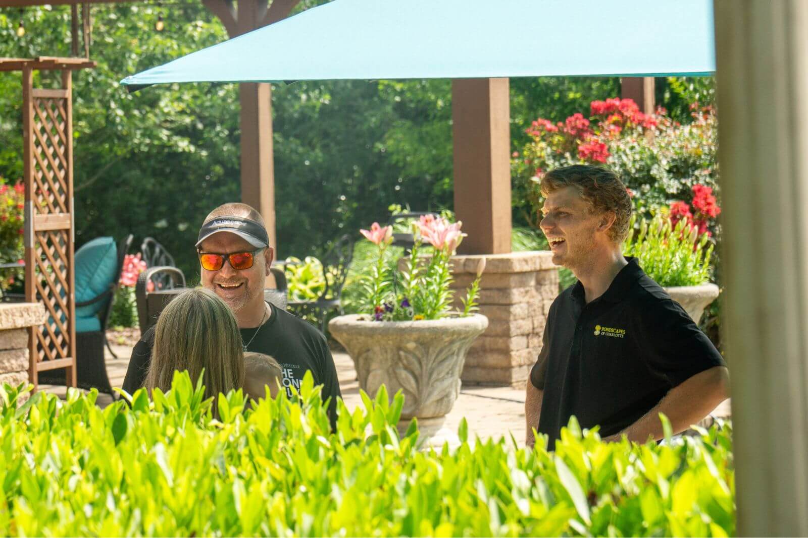 The Pondscapes of Charlotte team with Greg Wittstock during his visit to feature their Charlotte Backyard pond project.