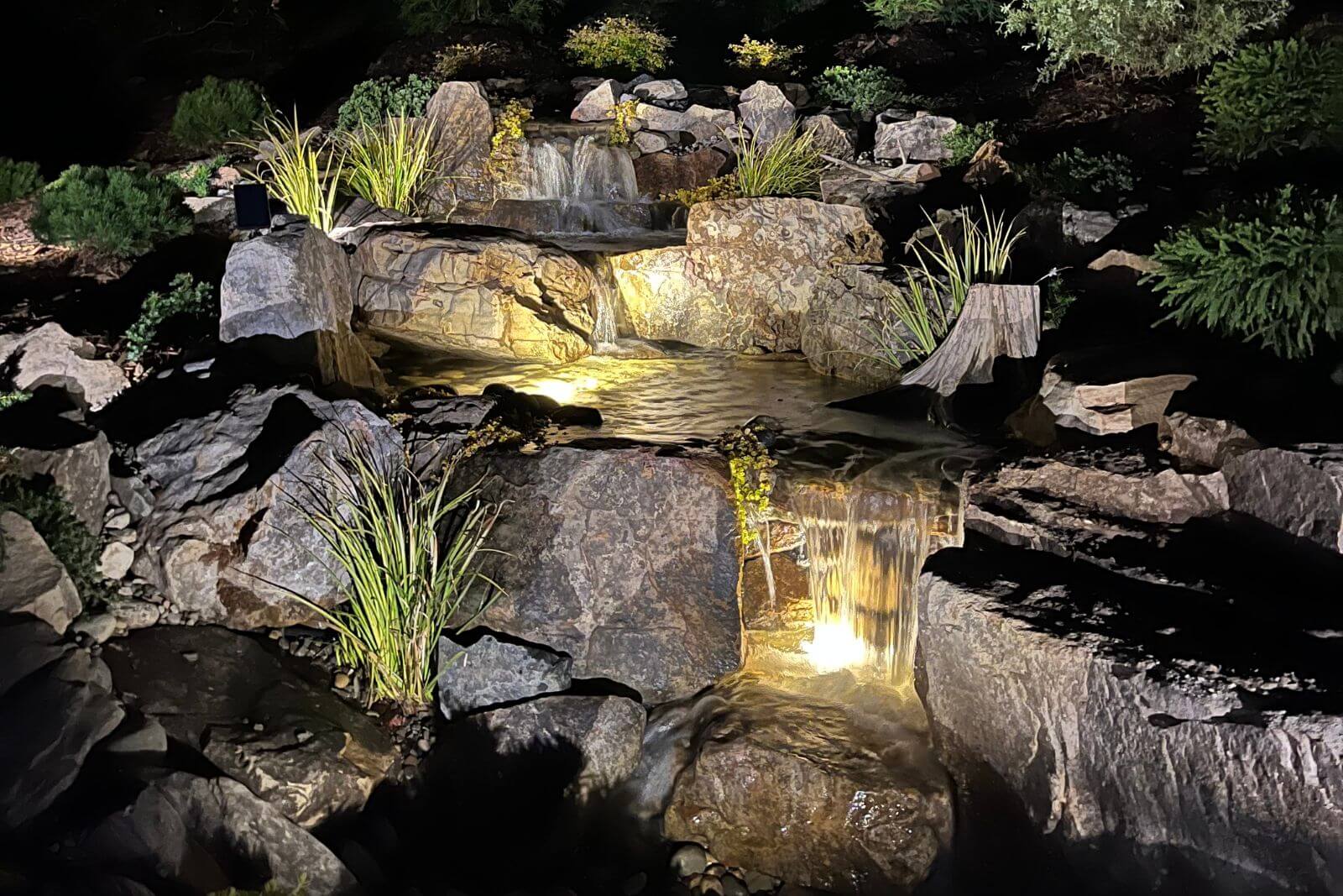 Mr. Tuttle’s stunning pondless waterfall in The Palisades, designed by Pondscapes of Charlotte and featured on the cover of Pond Trade Magazine’s Water Artisan of the Year Awards issue.