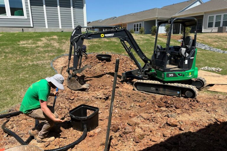 Pond excavation in progress with an Aquascape Skimmer 1000 being installed in the backyard of a home in Encore at Streamside, Waxhaw, NC.