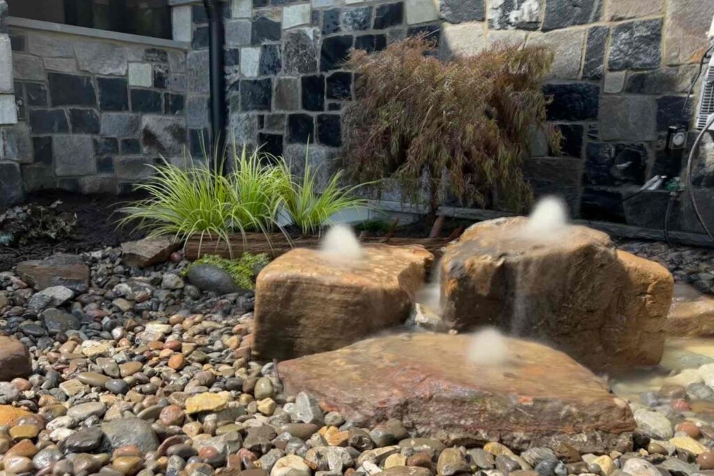Three Bubbling Boulders in Backyard Garden in Wedddington, NC