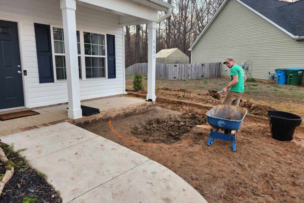 Pondscapes of Charlotte digging a koi pond during pond construction in Wesley Chapel, North Carolina
