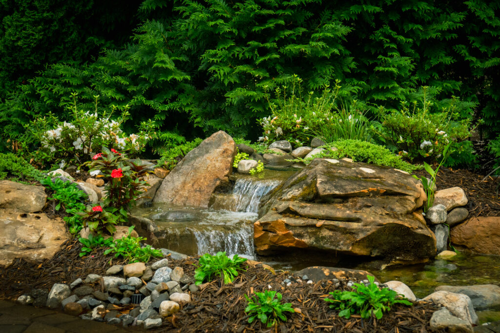 Crystal-clear water cascading over rocks, mimicking a natural mountain stream.
