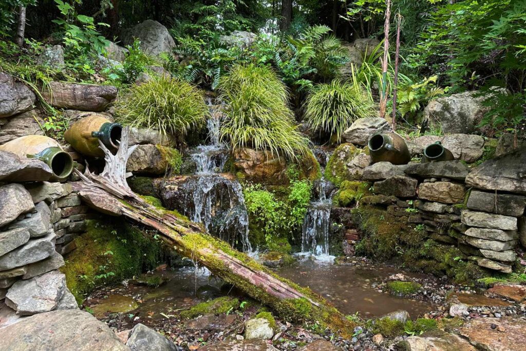 Waterfall in backyard in Charlotte, NC built by the top expert pond contractor in North and South Carolina Pondscapes of Charlotte