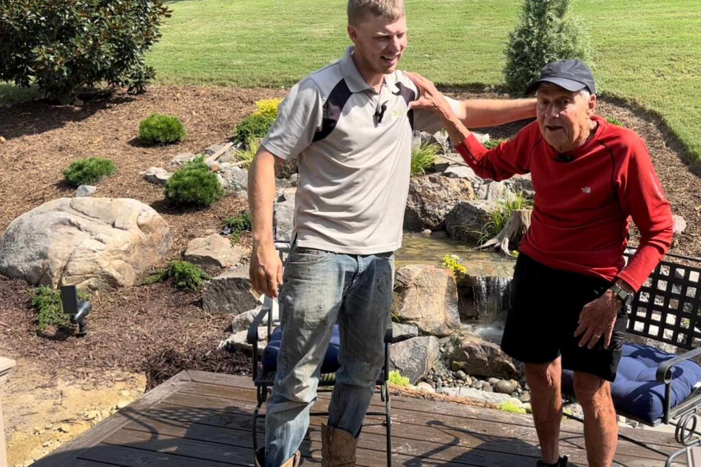 Brad with happy customer | Pondscapes of Charlotte