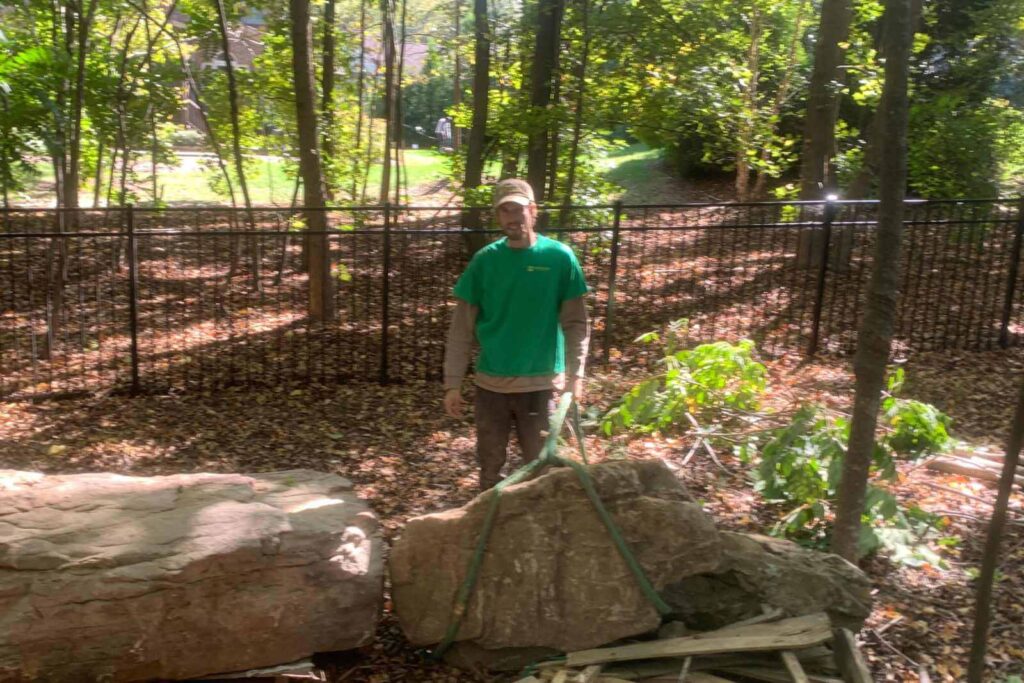 Braeden Strapping a Boulder with Pondscapes of Charlotte