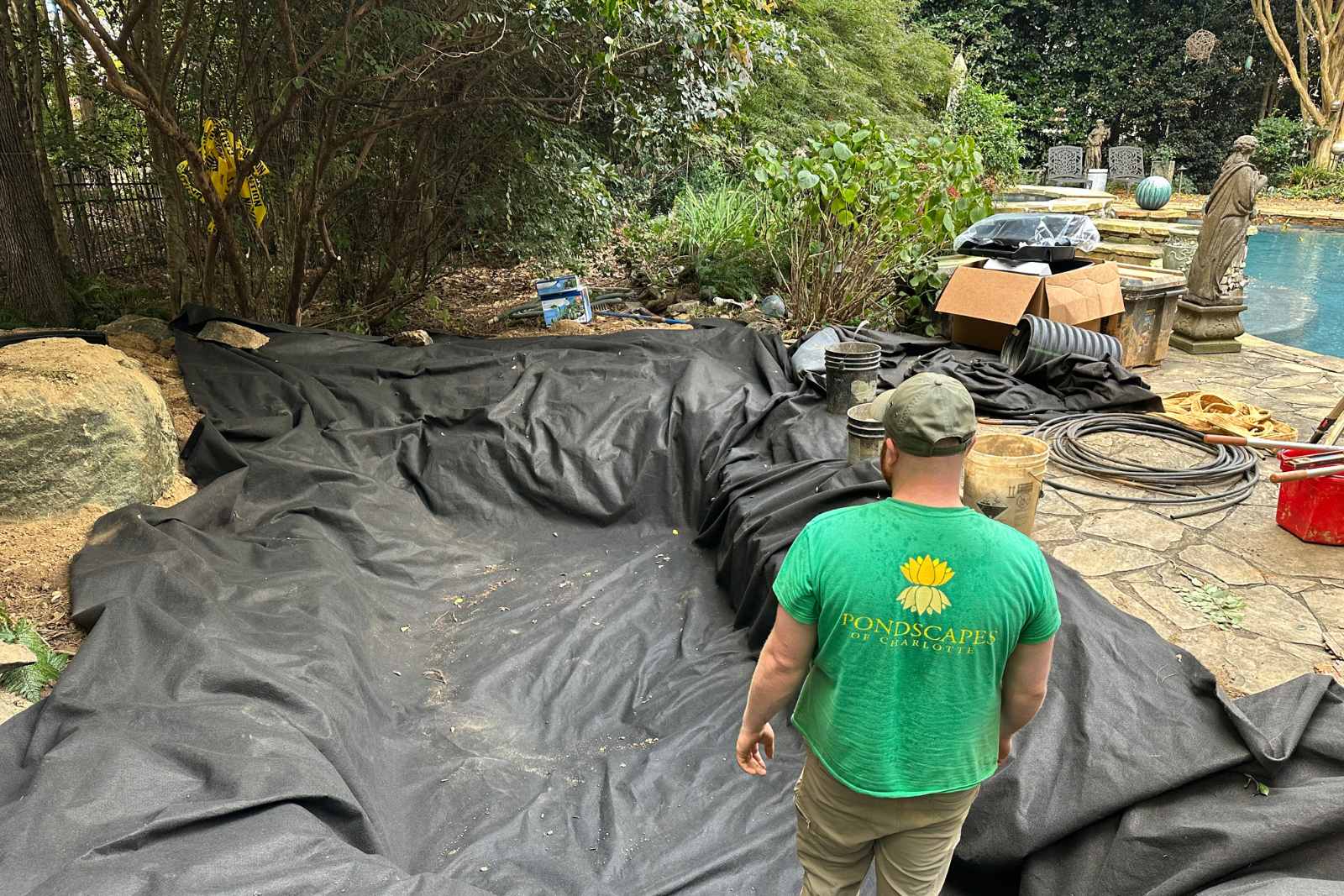 Underlayment to protect pond liner in South Park Pond Build by Pondscapes of Charlotte