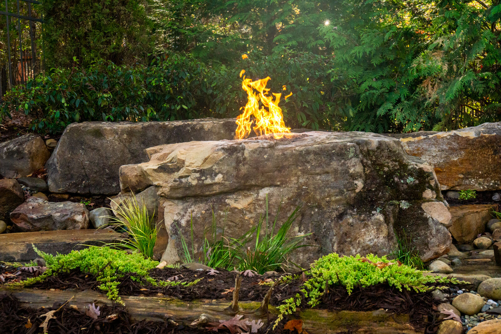 Backyard pondless waterfalls with natural fire boulder arrangement Fort Mill SC
