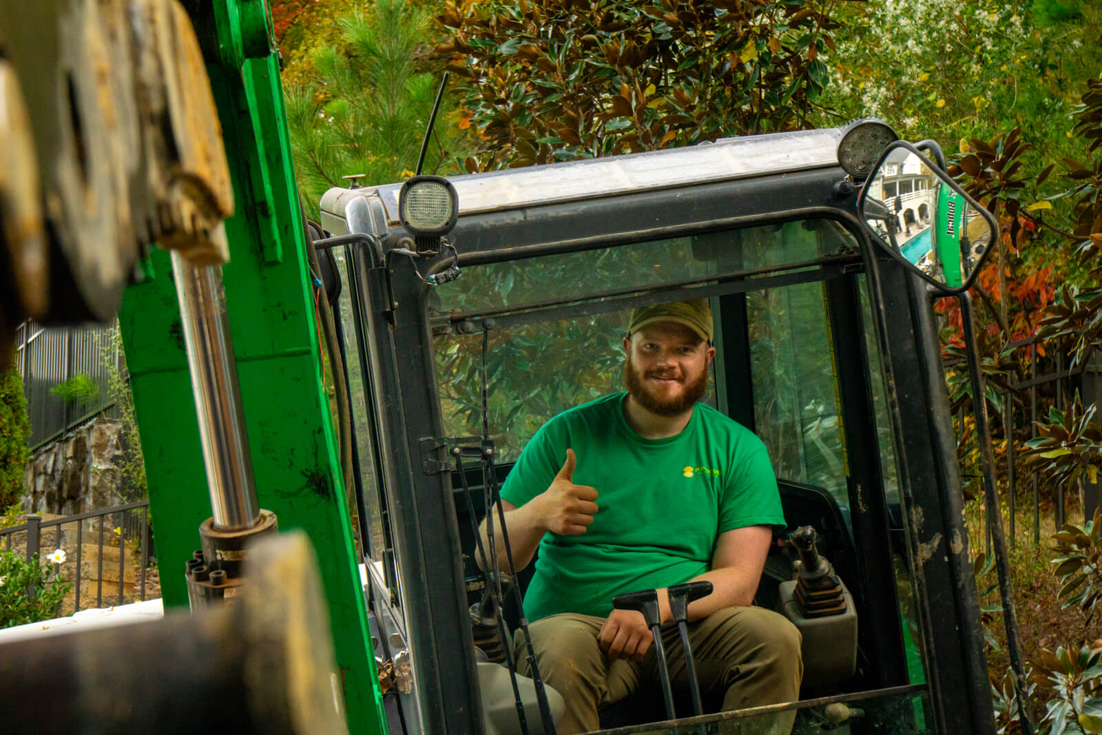 Pond tech driving excavator during pond construction in Fort Mill, SC