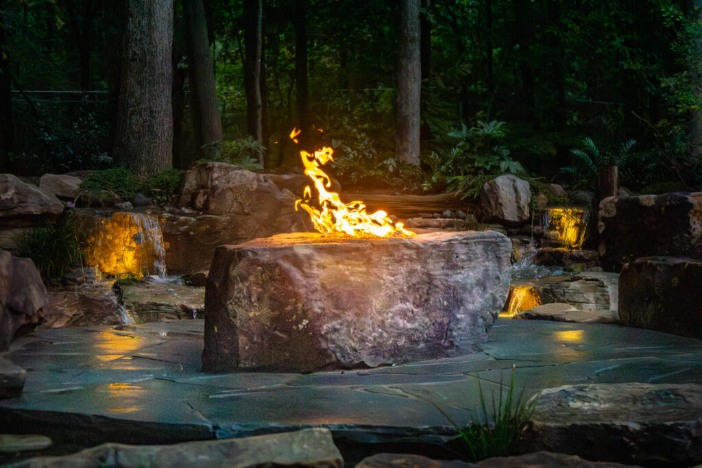 Water feature with flagstone patio and fire pit