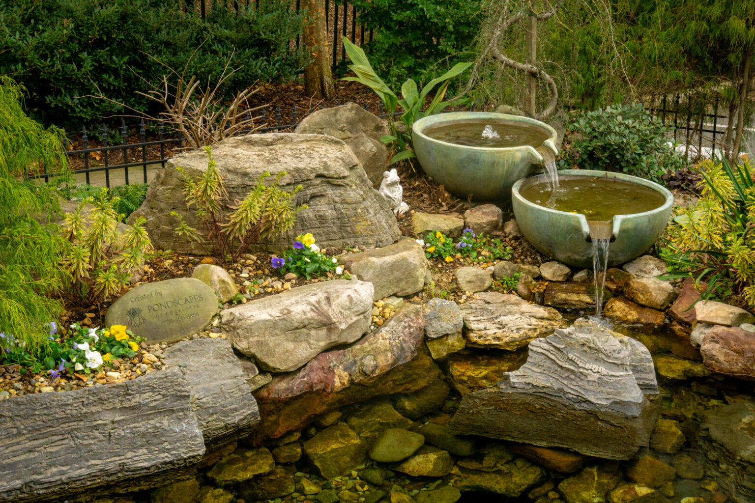 Natural stone pond with tiered Aquascape Spillover Bowl water feature and Pondscapes of Charlotte signature rock Matthews NC