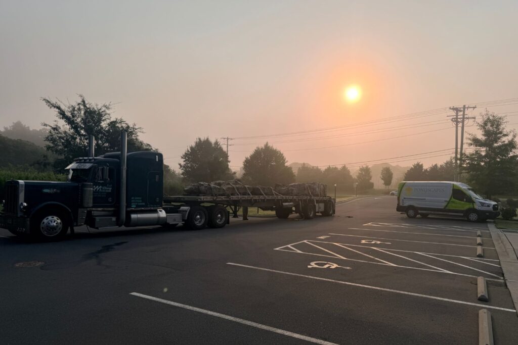 Delivery truck with rocks in the sunrise.