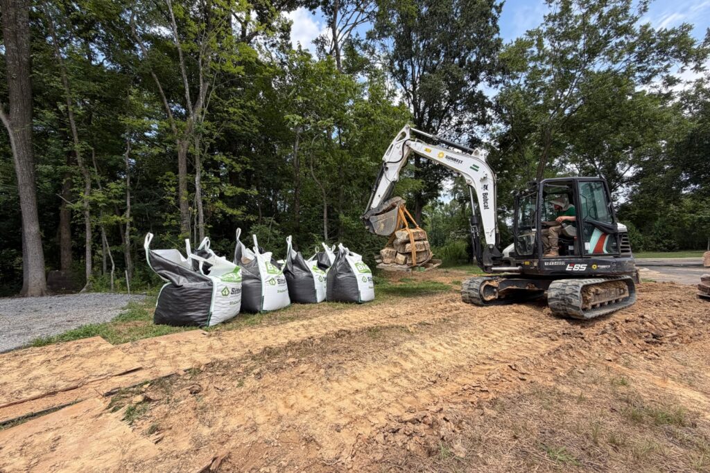 Job site receiving material and being prepared for new water feature install.