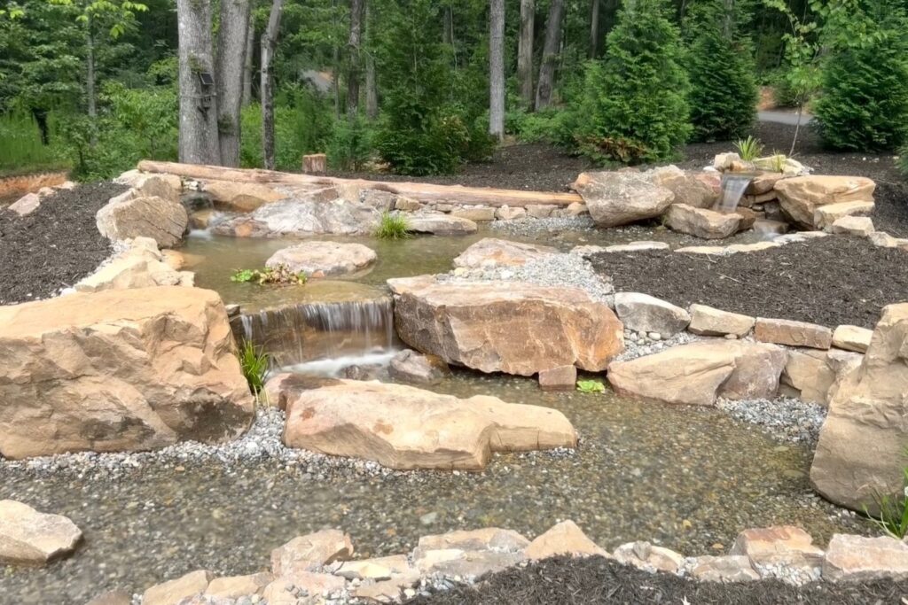 Large boulders make up a man made waterfall in Mint Hill, NC