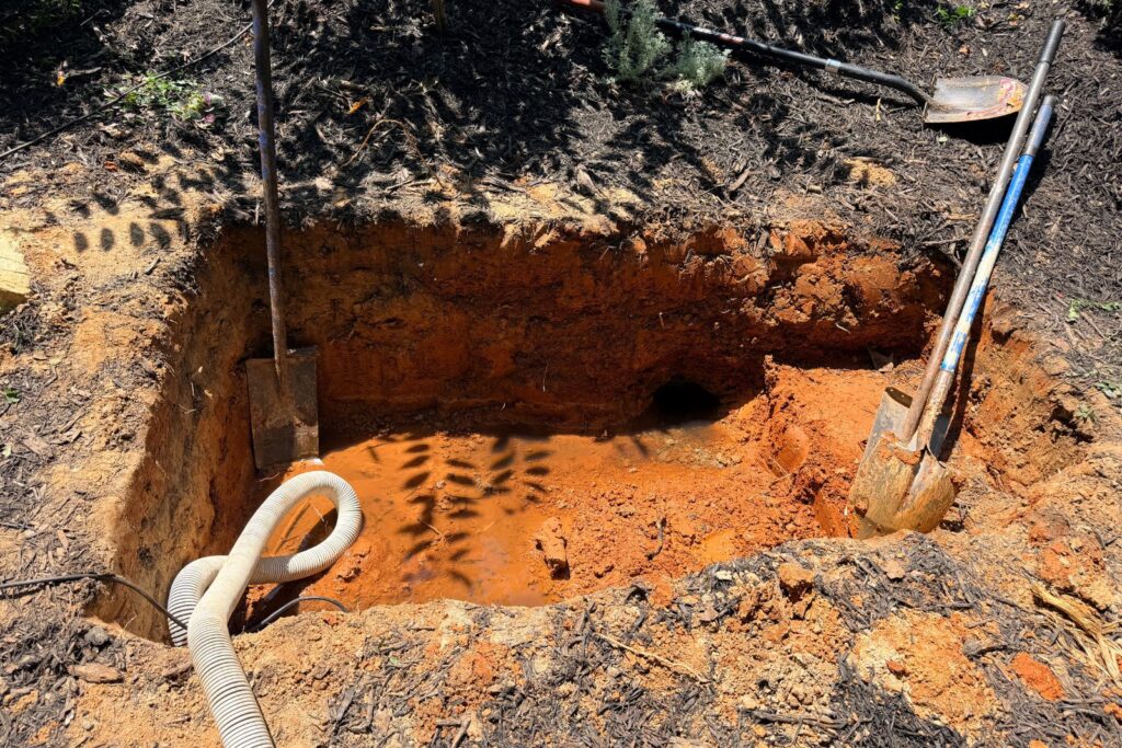 The rough excavation for our pondless reservoir for this bamboo fountain feature